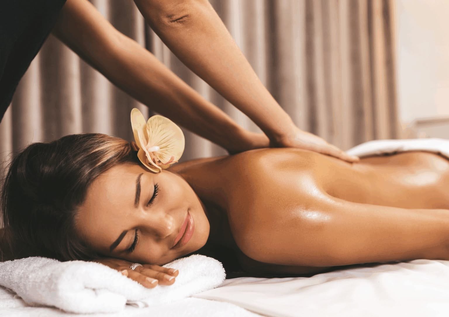 Woman receiving a relaxing back massage.